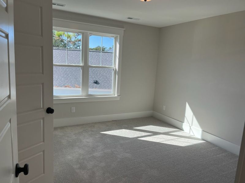 Spacious, unfurnished interior of a new home in Osprey Landing, Southport (Image 21).