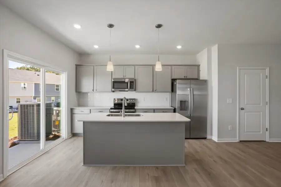 Furnished interior view inside a new home in West Main Townhomes, Sanford (Image 7).