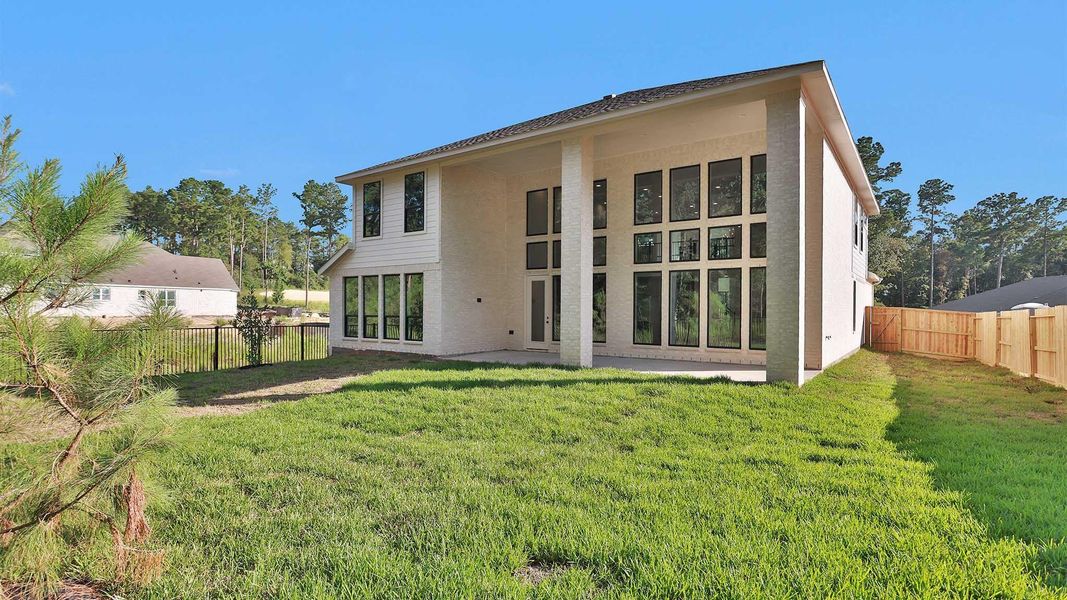 Exterior details and patio area of a home in The Woodlands Hills, Willis (Image 2). Exterior details and patio area of a home in The Woodlands Hills, Willis (Image 2).