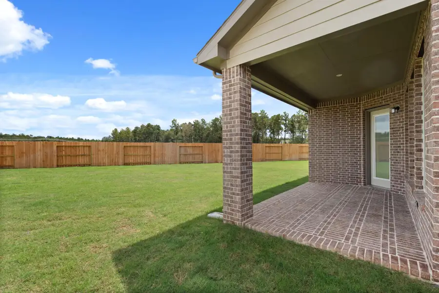 Exterior details and patio area of a home in The Trails, New Caney (Image 3).