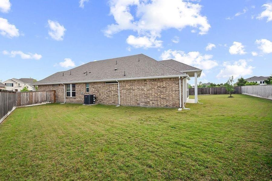 There is a side yard on each side of this home There is a side yard on each side of this home