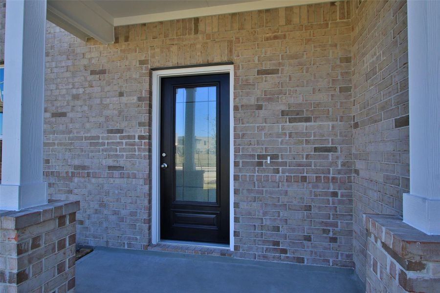 Exterior details and patio area of a home in Sunterra, Katy (Image 22).