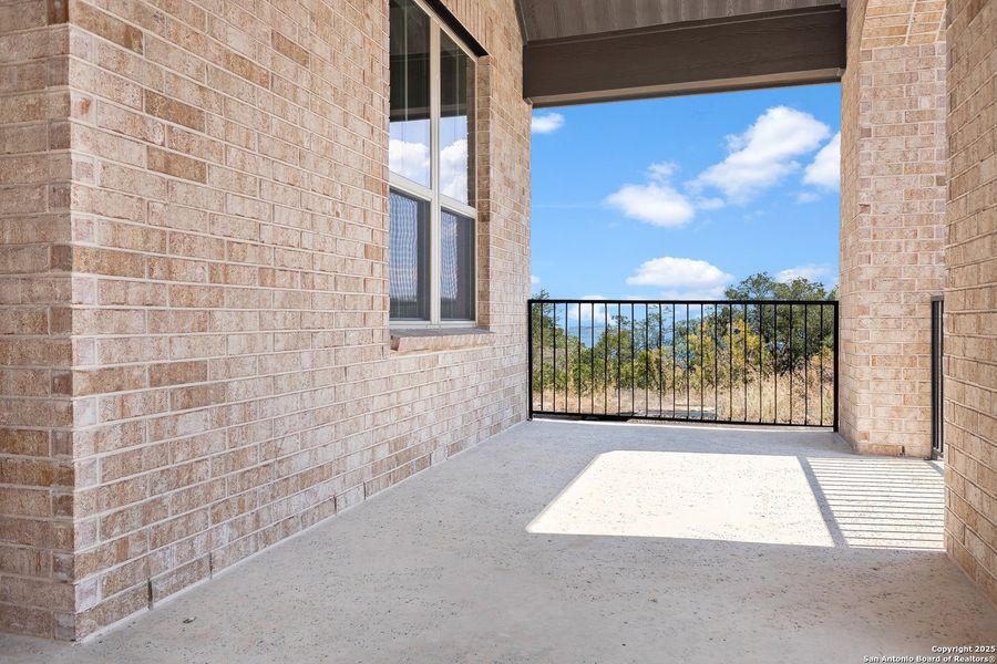 Exterior details and patio area of a home in The Enclave at Potranco Oaks, Castroville (Image 23).