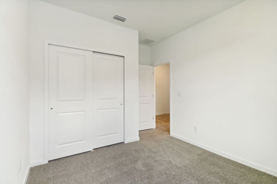 Secondary bedroom of the Bluebell plan in Lakes at Bella Lago.