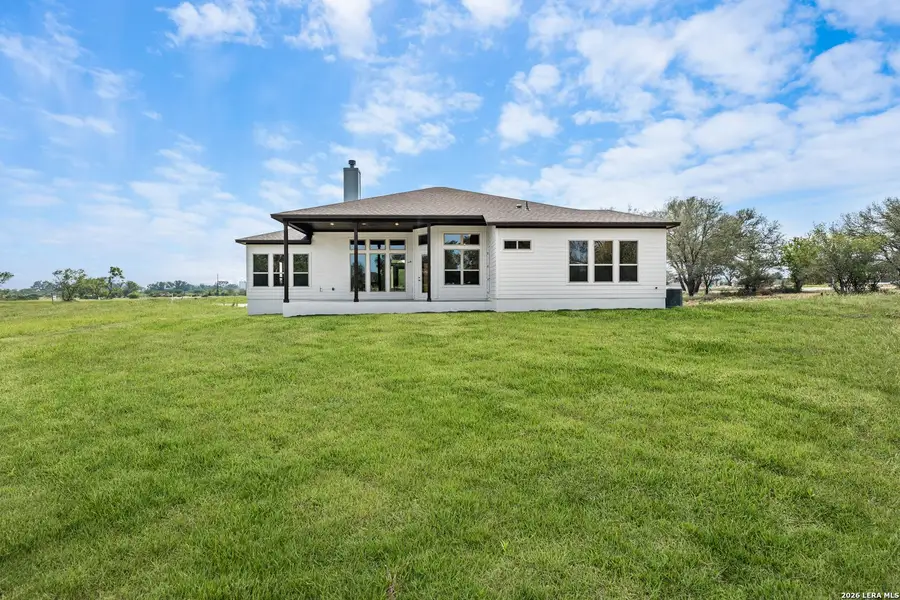 Exterior details and patio area of a home in Legend Park, Castroville (Image 3).