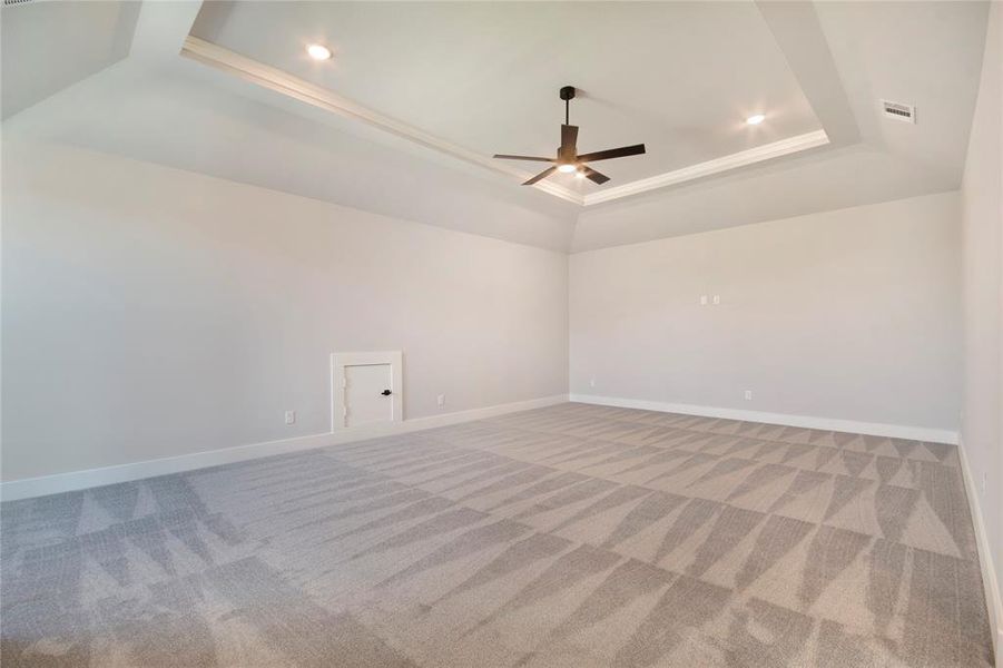 Spare room with a tray ceiling, light carpet, crown molding, recessed lighting, and ceiling fan Spare room with a tray ceiling, light carpet, crown molding, recessed lighting, and ceiling fan