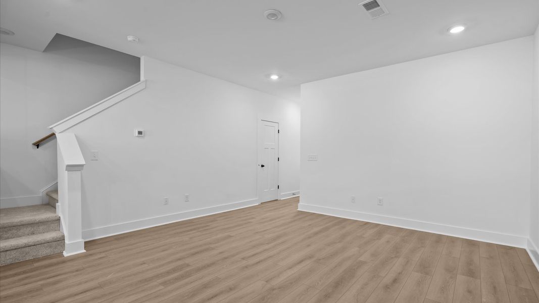 First-rate hardwood flooring and thoughtful upgrades in this select townhome by DRB Homes