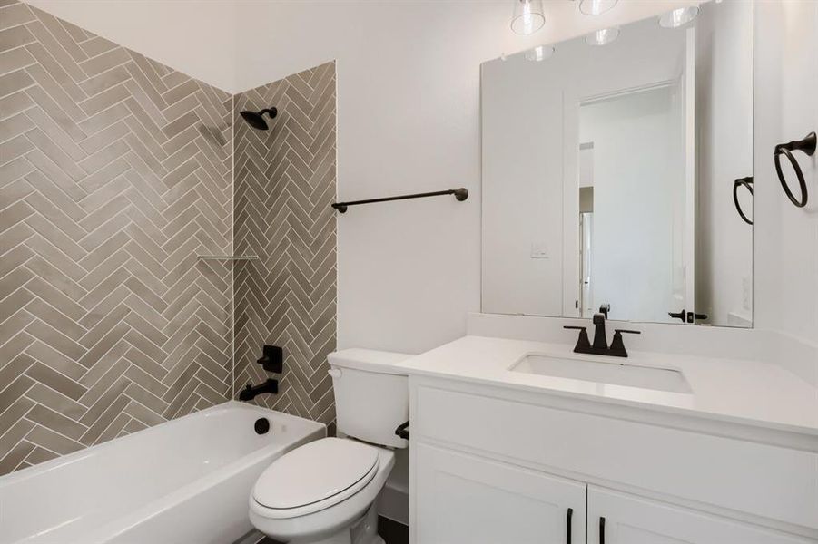 Bathroom featuring vanity and shower / tub combination
