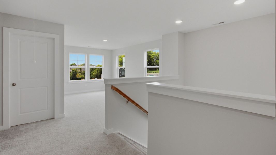Versatile upstairs living area next to staircase Versatile upstairs living area next to staircase