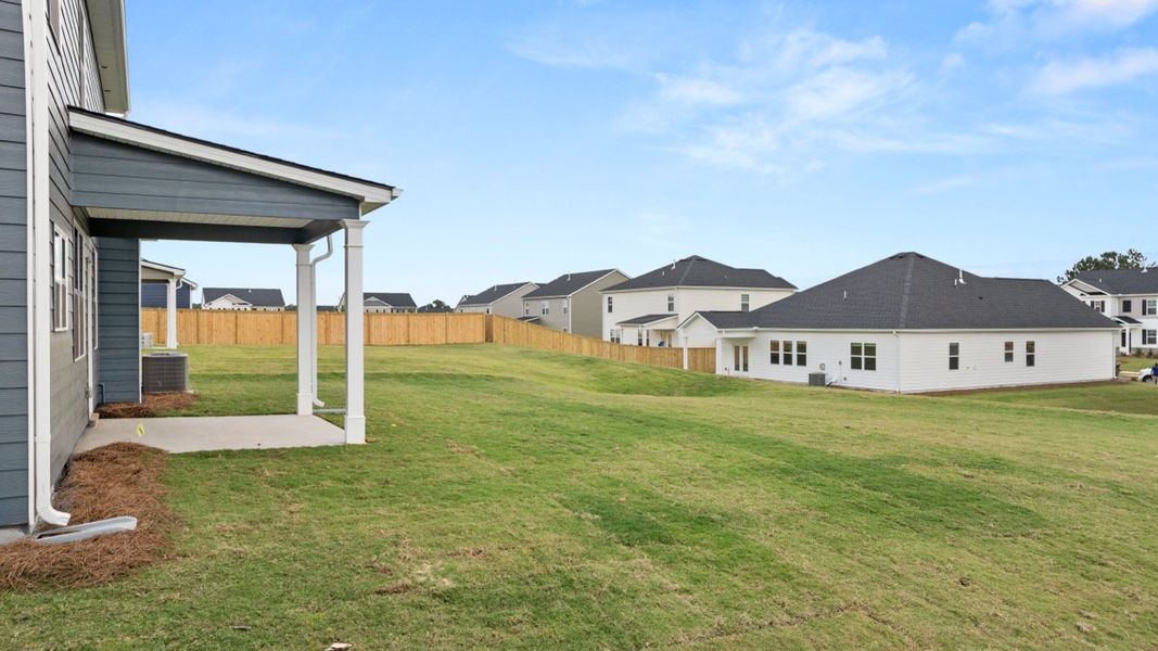 Exterior details and patio area of a home in Preserve at Dove Creek, Statham (Image 20).