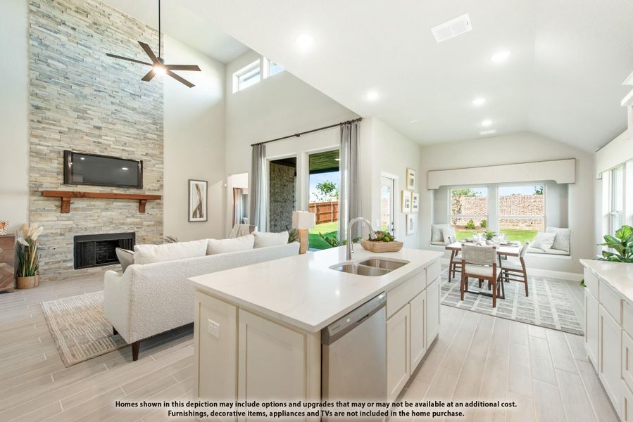 Open-concept kitchen with island sink, vaulted ceilings, stone fireplace, and dining and living areas visible Open-concept kitchen with island sink, vaulted ceilings, stone fireplace, and dining and living areas visible