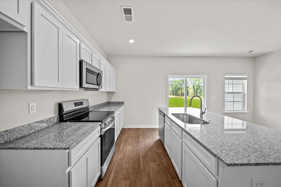 Representative furnished interior of a home built from the Palmetto II by McGuinn Homes in Clarke Townes, Anderson (Image 53).