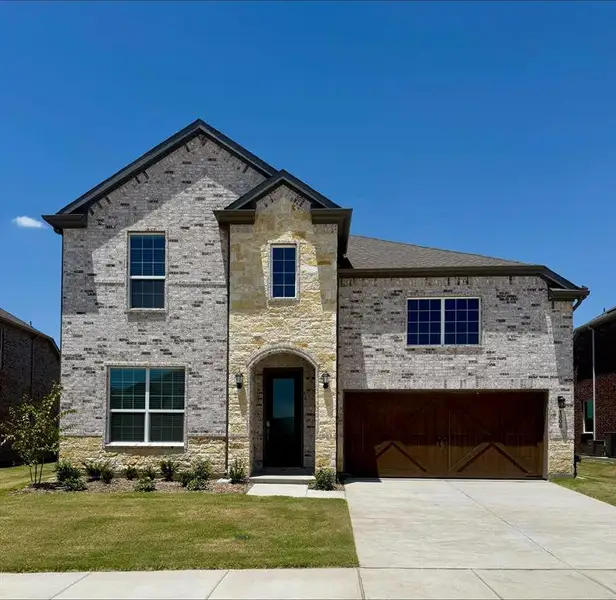 Front exterior of a new home in , Celina, TX, highlighting curb appeal (Image 1). Front exterior of a new home in , Celina, TX, highlighting curb appeal (Image 1).