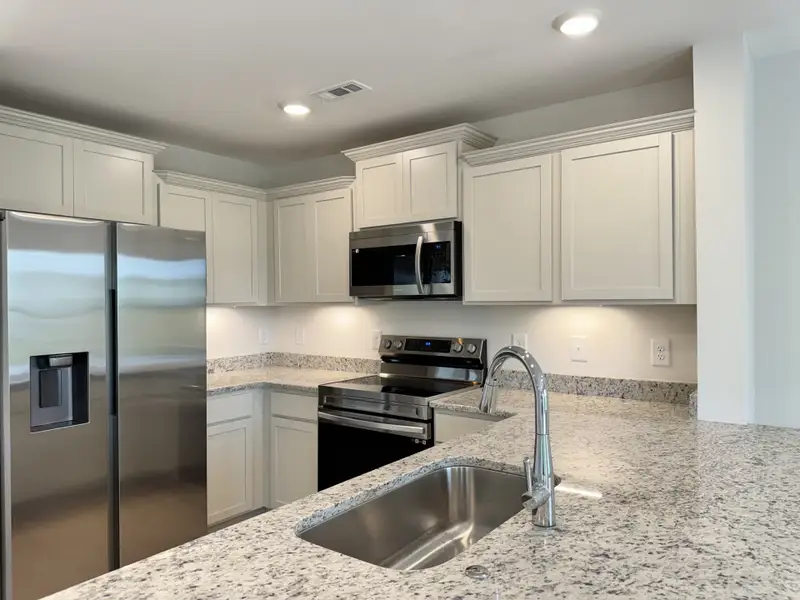 Furnished interior view inside a new home in Wheatfield, Shelbyville (Image 1).