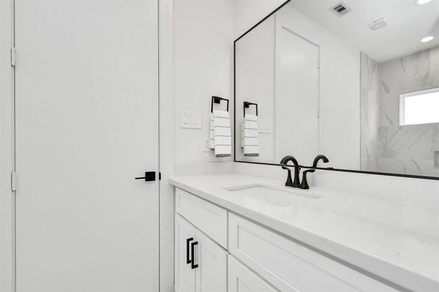 Indulge in the luxury and convenience of the jack and jill bathroom adjoining both guest bedrooms featuring generous vanity, ample space for your toiletries and personal essentials