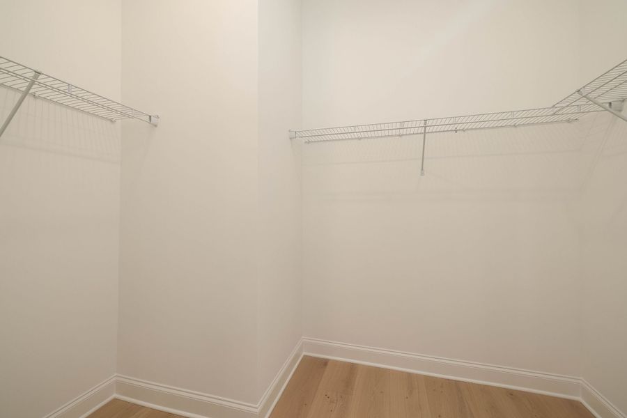 Large master closet with shelving