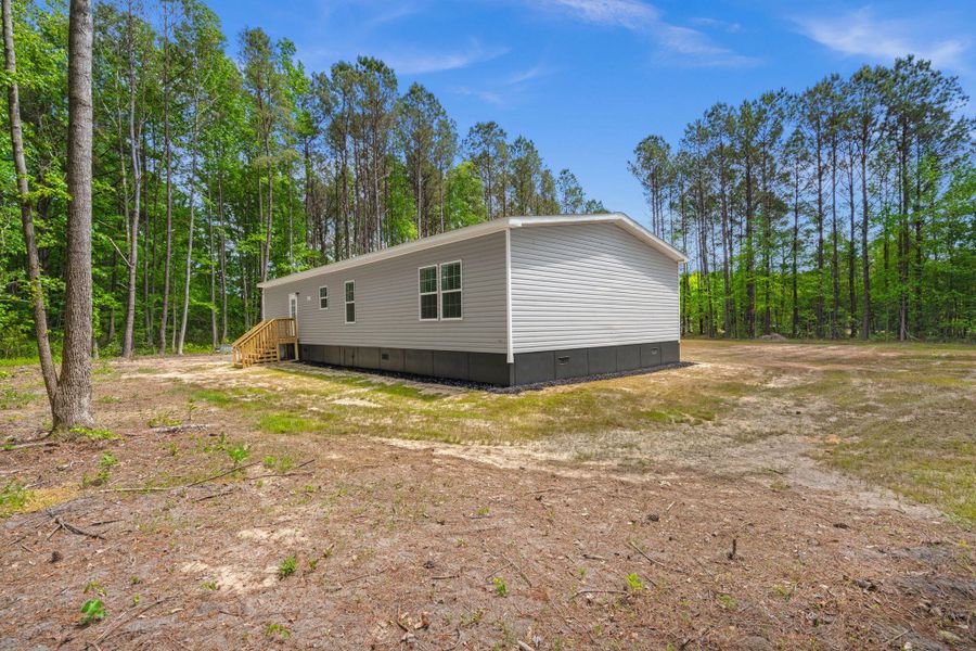 Exterior details and patio area of a home in , Cottageville (Image 17).