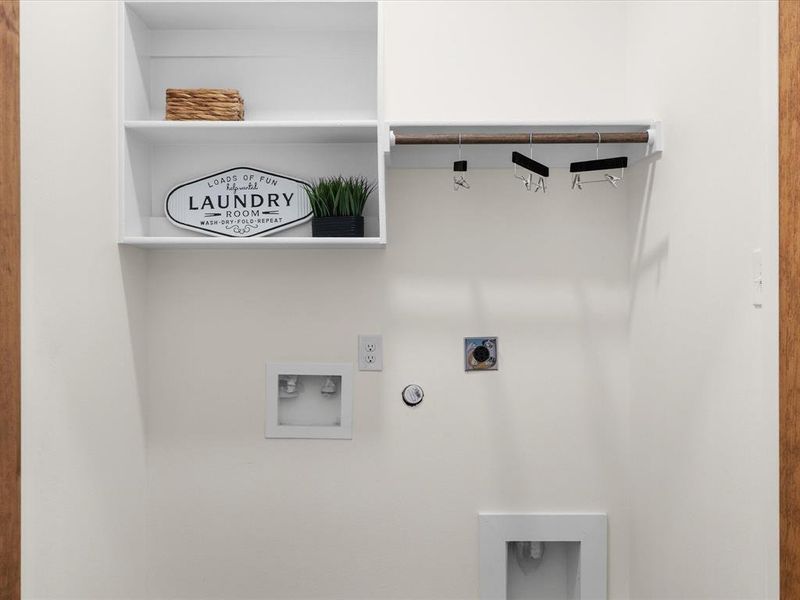 Laundry area with hookup for a gas dryer, electric dryer hookup, and washer hookup