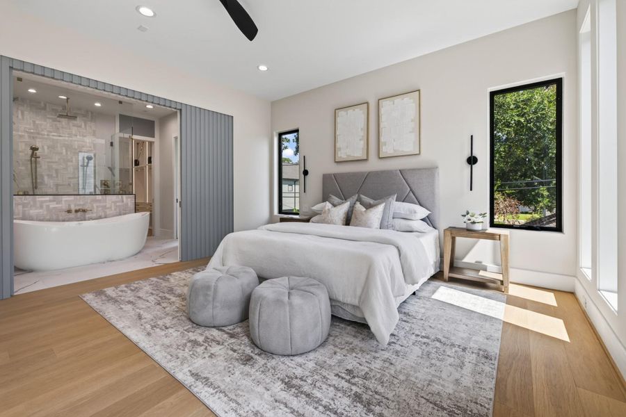 Serene primary suite with plush carpeting, soft natural light, and a spa-like ambiance.