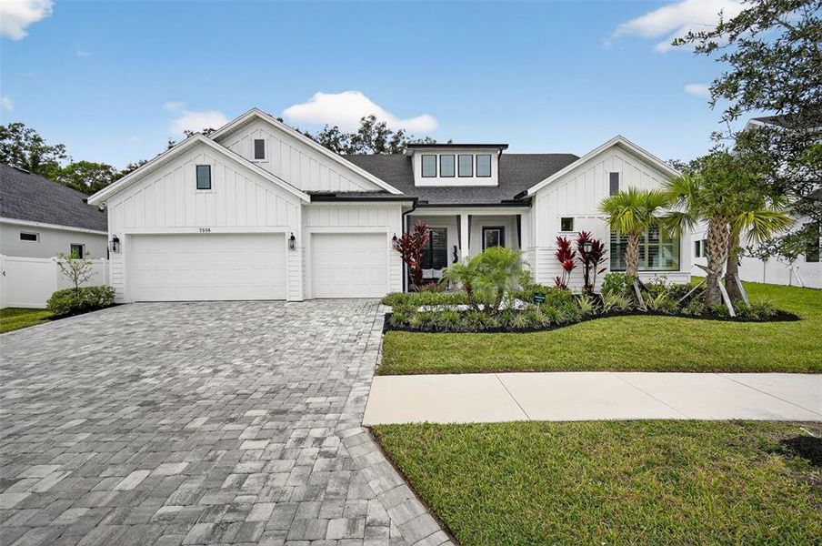Front exterior of a new home in , Odessa, FL, highlighting curb appeal (Image 1).