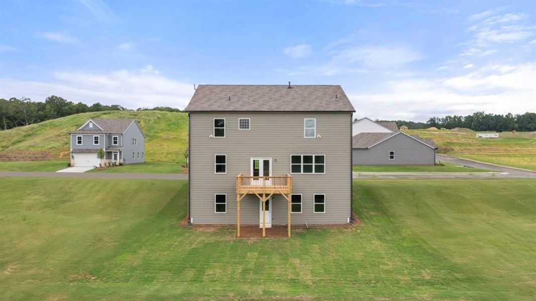 Front exterior of a new home in Sheffield Highlands, Dallas, GA, highlighting curb appeal (Image 19).