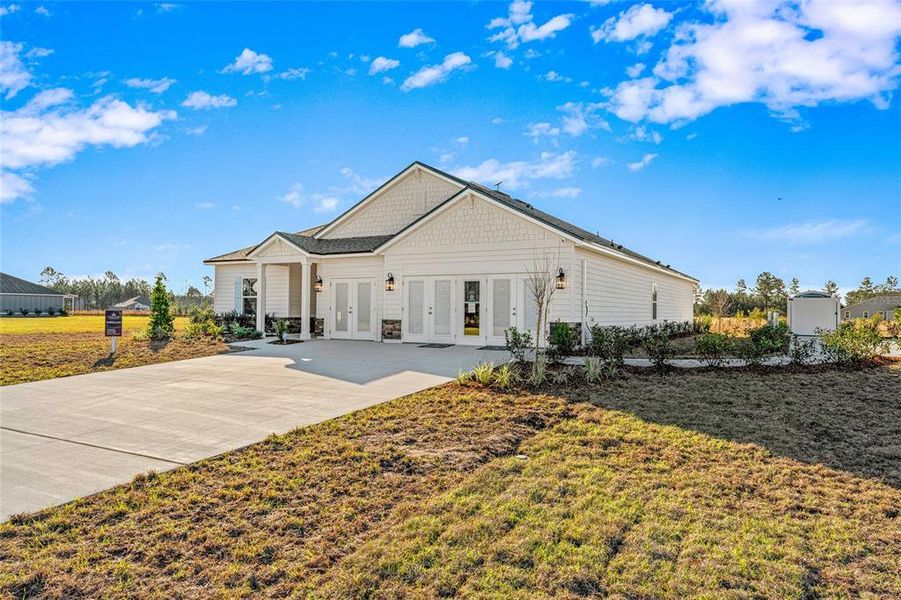 Front exterior of a new home in The Cypress Series at Reserve East, Flagler Beach, FL, highlighting curb appeal (Image 20). Front exterior of a new home in The Cypress Series at Reserve East, Flagler Beach, FL, highlighting curb appeal (Image 20).