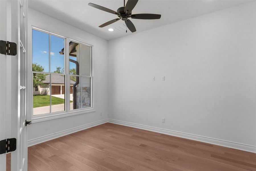 Bright hardwood floors and generous windows define this adaptable room.