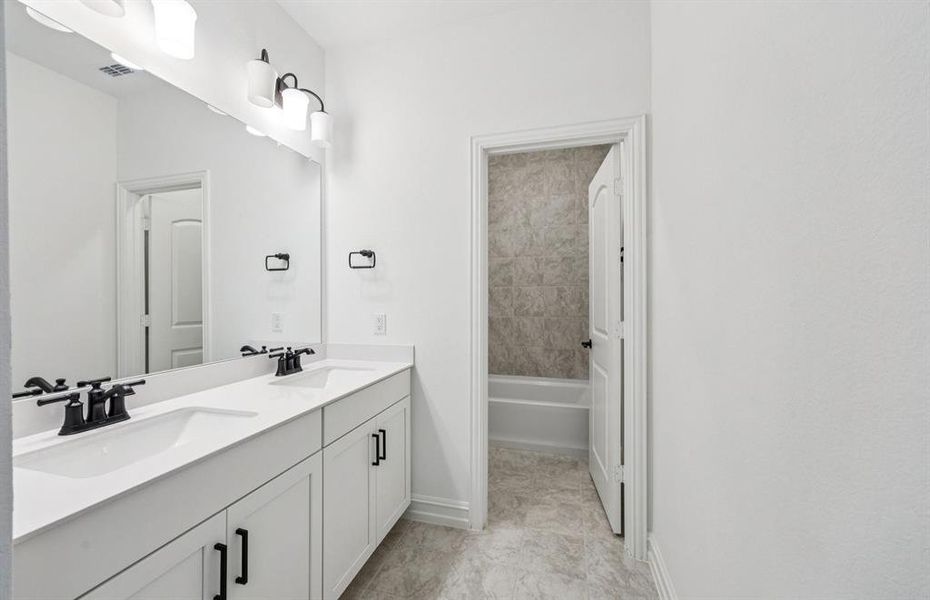 Second floor full bath with abundant storage space and double sinks Second floor full bath with abundant storage space and double sinks