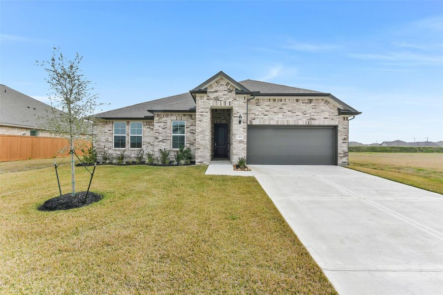 Front exterior of a new home in Lago Mar, Texas City, TX, highlighting curb appeal (Image 1). Front exterior of a new home in Lago Mar, Texas City, TX, highlighting curb appeal (Image 1).
