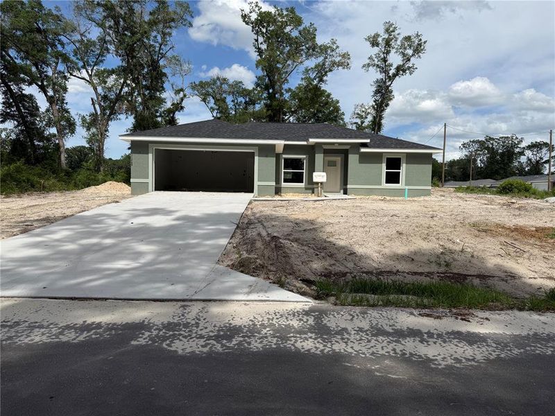 Front exterior of a new home in , Dunnellon, FL, highlighting curb appeal (Image 1). Front exterior of a new home in , Dunnellon, FL, highlighting curb appeal (Image 1).