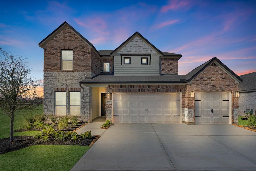 Front exterior of a new home in Sunterra Lakes, Fulshear, TX, highlighting curb appeal (Image 21).