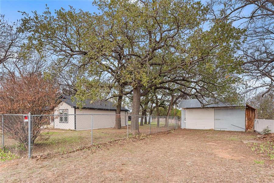 View of yard with an outdoor structure
