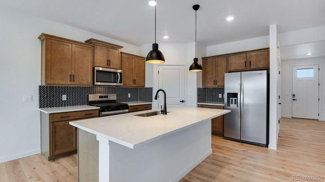 Furnished interior view inside a new home in Trails at Crowfoot, Parker (Image 7).