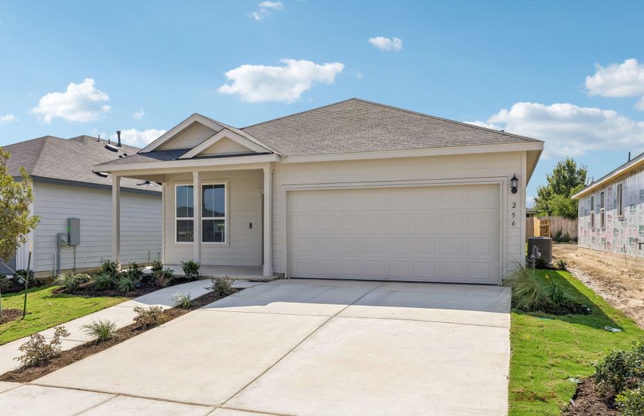 Front exterior of a new home in Vantage, San Marcos, TX, highlighting curb appeal (Image 18).