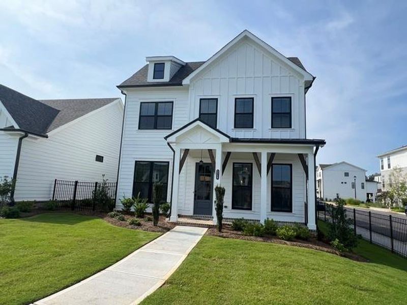 Front exterior of a new home in Promenade at Sawnee Village, Cumming, GA, highlighting curb appeal (Image 23).