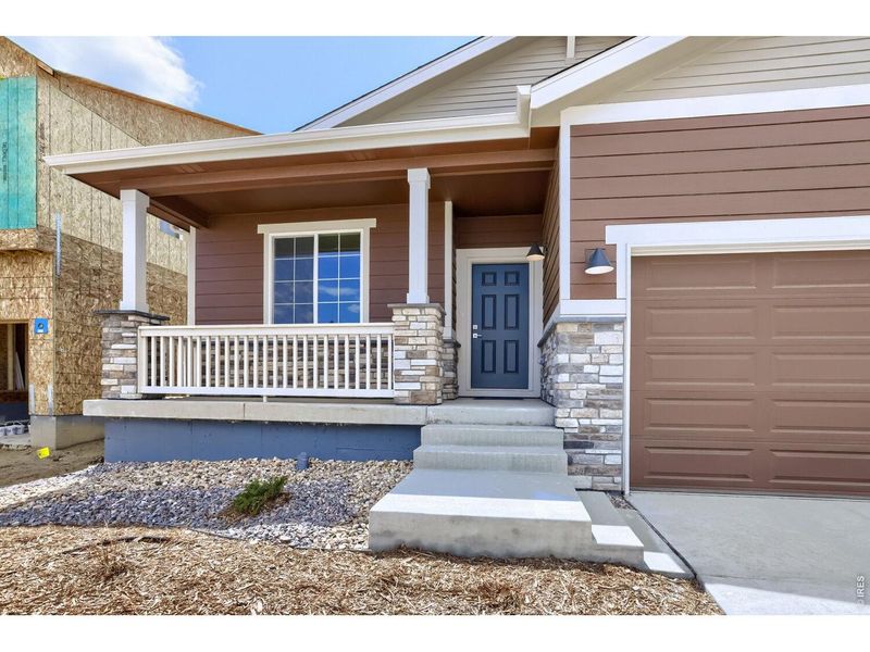 Exterior details and patio area of a home in Farmstead, Berthoud (Image 3).