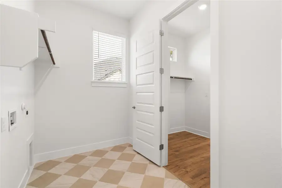 Functional shelving and easy access to a spacious walk-in closet. Functional shelving and easy access to a spacious walk-in closet.