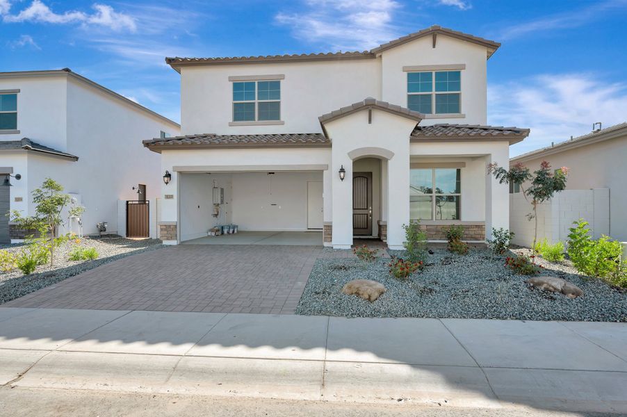 Front exterior of a new home in Artesa at Soleo, San Tan Valley, AZ, highlighting curb appeal (Image 2). Front exterior of a new home in Artesa at Soleo, San Tan Valley, AZ, highlighting curb appeal (Image 2).