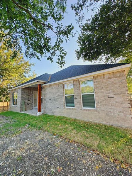 Front exterior of a new home in , Waxahachie, TX, highlighting curb appeal (Image 15). Front exterior of a new home in , Waxahachie, TX, highlighting curb appeal (Image 15).