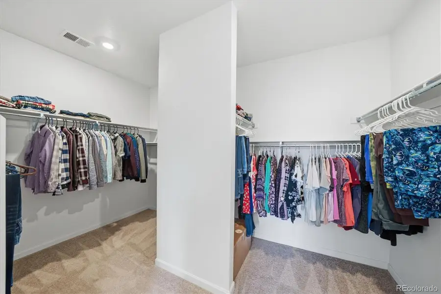 Primary walk in closet.