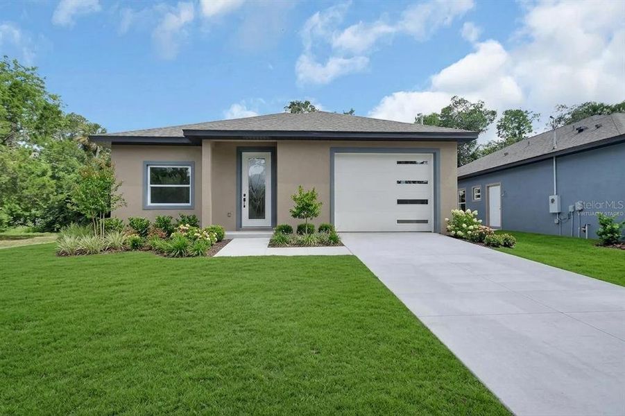 Front exterior of a new home in , Daytona Beach, FL, highlighting curb appeal (Image 1). Front exterior of a new home in , Daytona Beach, FL, highlighting curb appeal (Image 1).