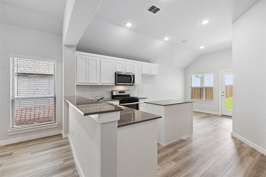 Kitchen in the Amber home plan by Trophy Signature Homes – REPRESENTATIVE PHOTO