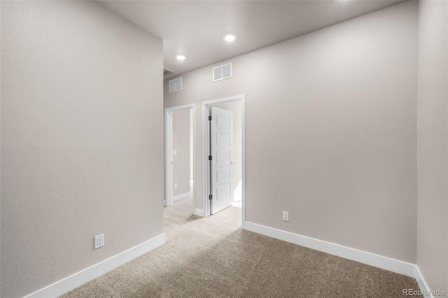 Spacious, unfurnished interior of a new home in Ralston Creek, Arvada (Image 29).