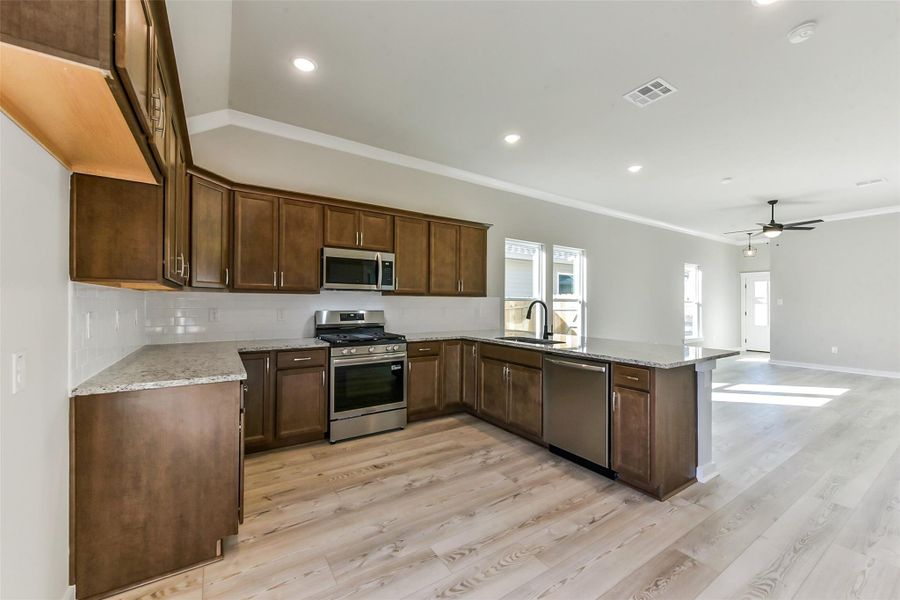 Furnished interior view inside a new home in Aldeana, Bonney (Image 18).