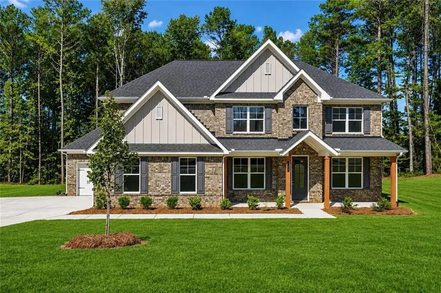 Front exterior of a new home in Patillo Manor, Stockbridge, GA, highlighting curb appeal (Image 19).