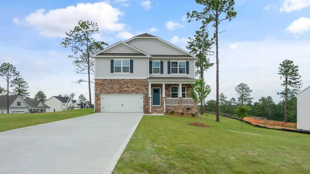 Front exterior of a new home in Gretchen Pines, West End, NC, highlighting curb appeal (Image 2). Front exterior of a new home in Gretchen Pines, West End, NC, highlighting curb appeal (Image 2).