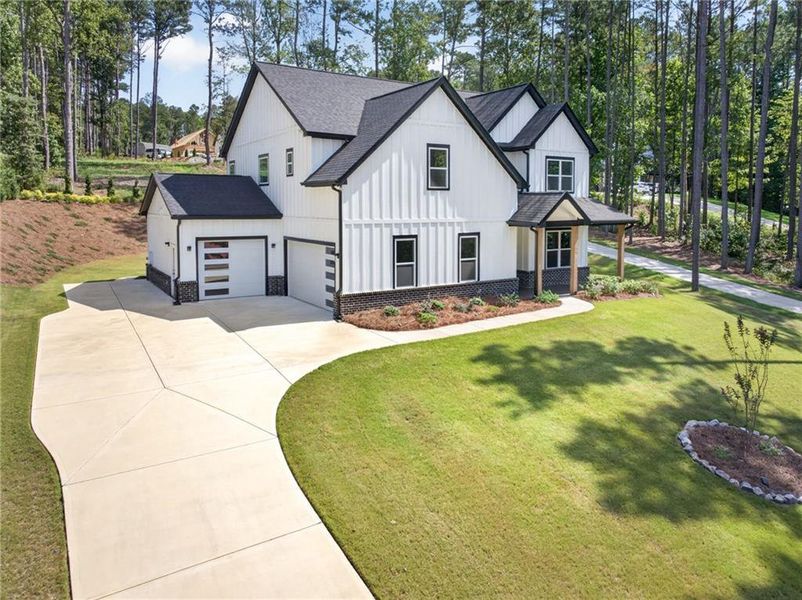 Front exterior of a new home in , Winder, GA, highlighting curb appeal (Image 27).