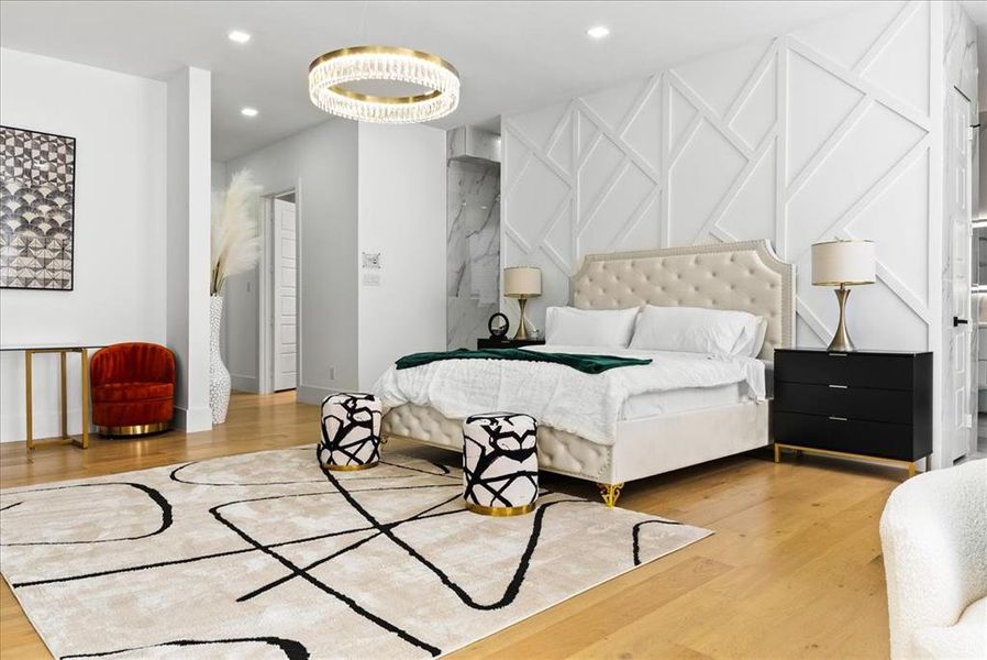 Bedroom featuring Hardwoods, and massive Ring designer chandelier