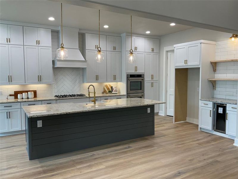 Living room is open to kitchen with large 10 ft island