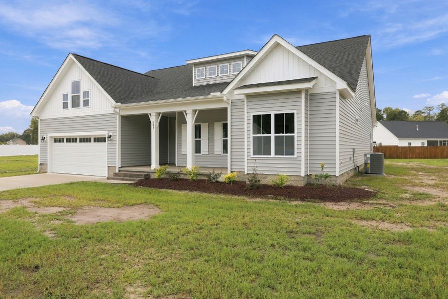 Front exterior of a new home in Laurel Oaks, Greenville, NC, highlighting curb appeal (Image 26).
